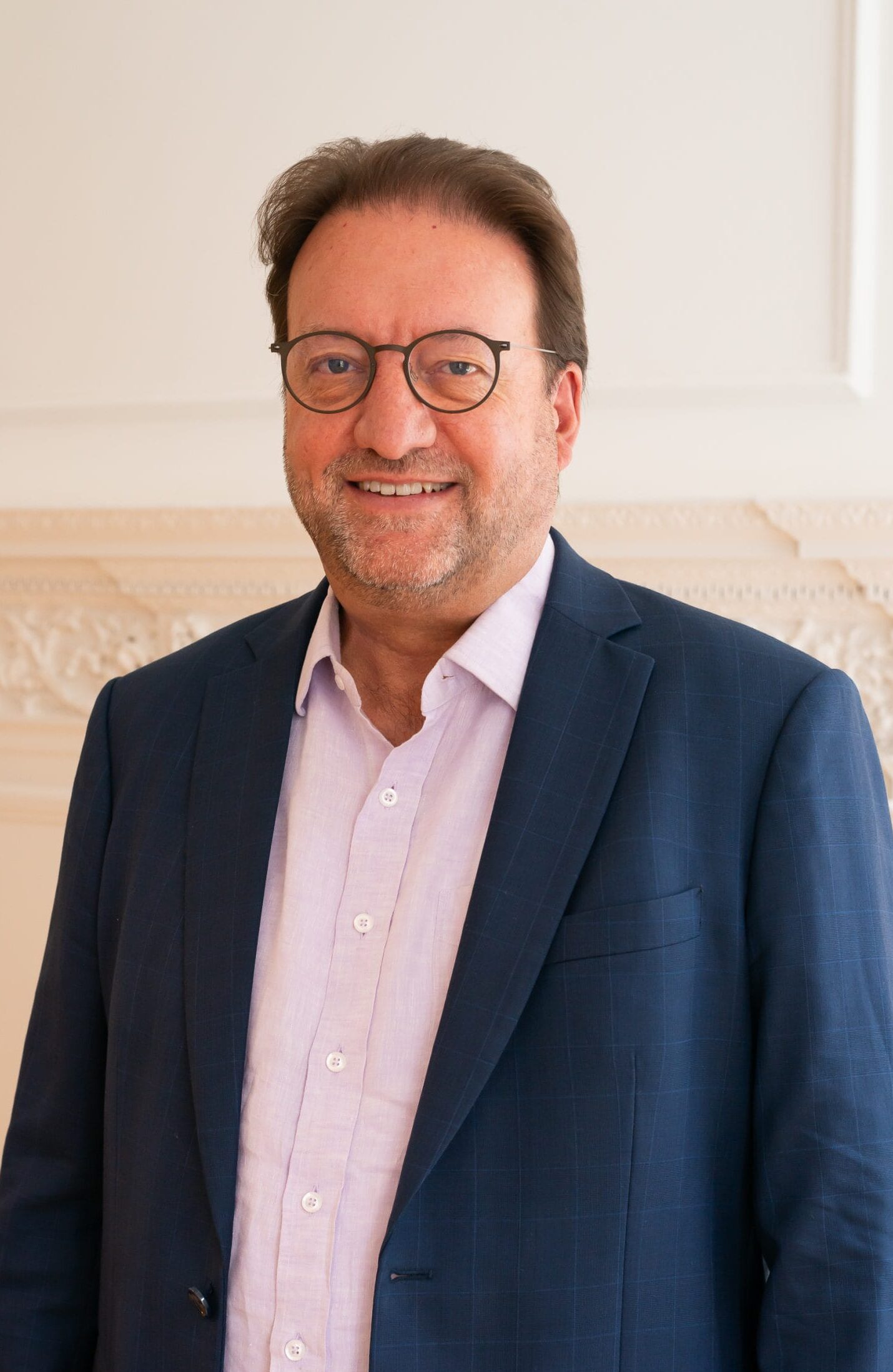 Image: Paul Owens, Co-founder of BOP Consulting, standing in the BOP offices